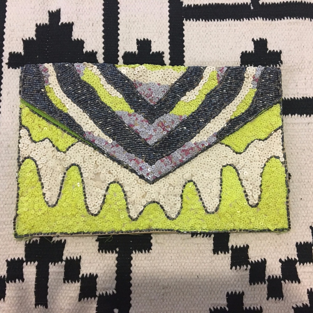 Green graphic sequin clutch